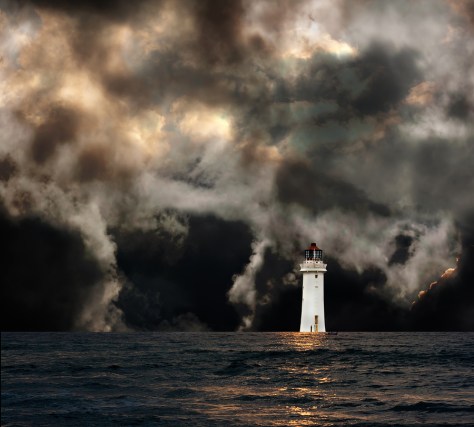 White Lighthouse With Dramatic Storm Clouds